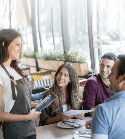 Server with guest using a tablet